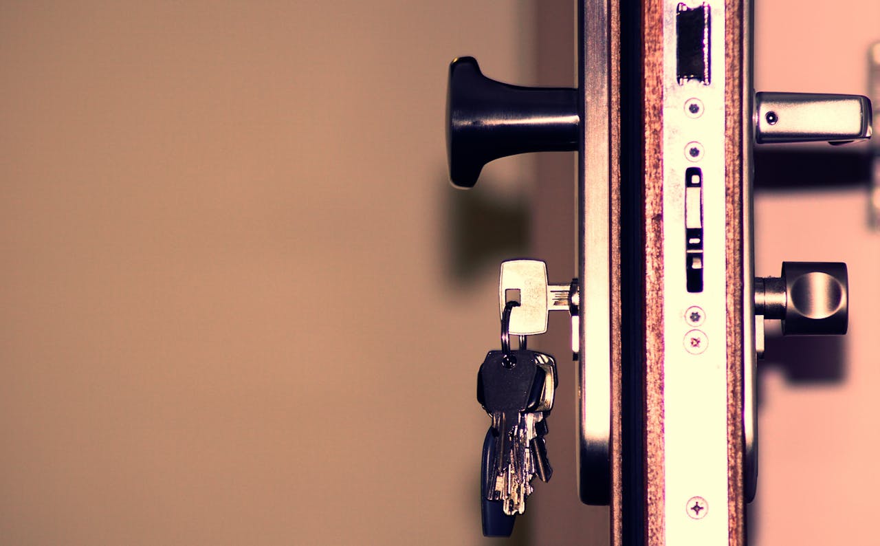 Services Detailed view of a door lock and keys emphasizing security and access.
